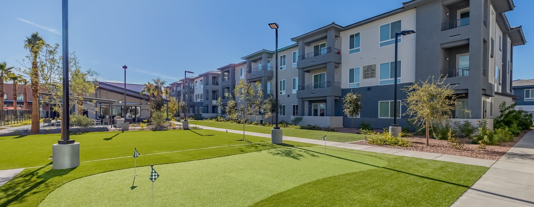 a building with a lawn and trees