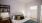 a bedroom with a bed and a bookcase
